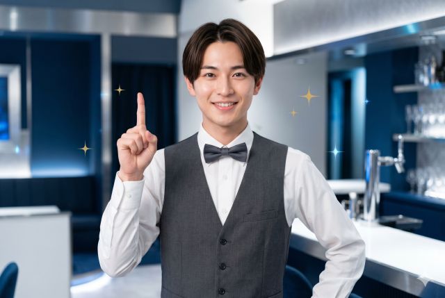人差し指を立てる男性