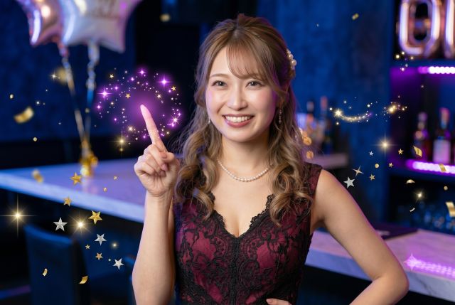 人差し指を立てる女性